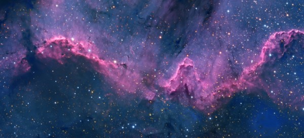 blue sky filled with stars and a purple cloud