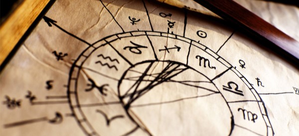 signs of the zodiac hand written on an old piece of parchment