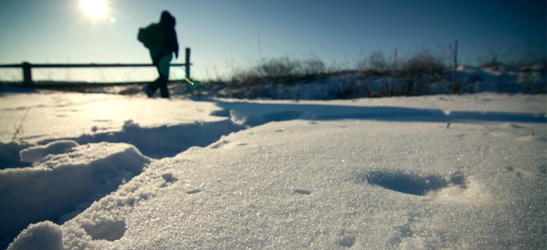 a man walking in the snow