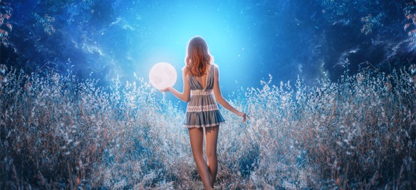 a woman walking through a field holding the moon