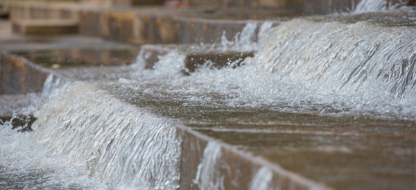 flooding causes water to pour down concrete steps